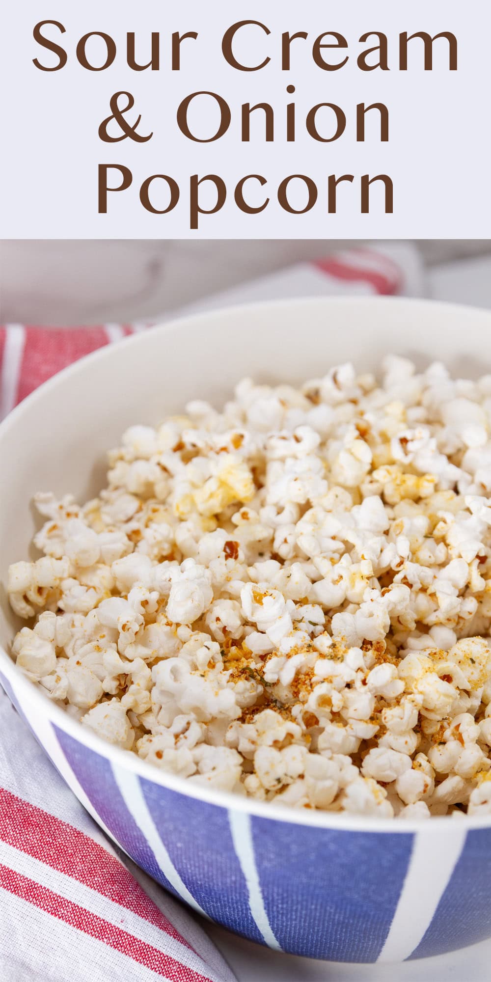 A large blue bowl filled with seasoned popcorn.