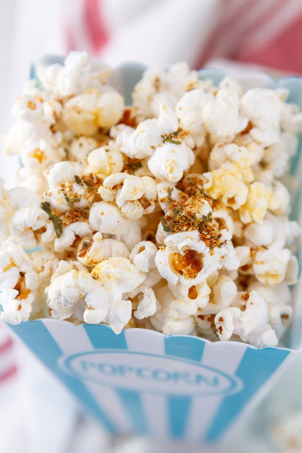 looking down into a container of popcorn.