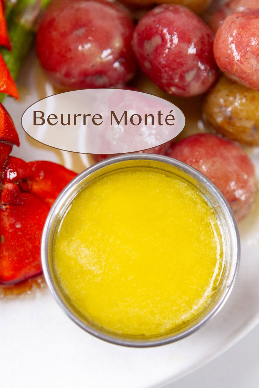 a small container of Beurre Mont&eacute; butter sauce next to some potatoes.
