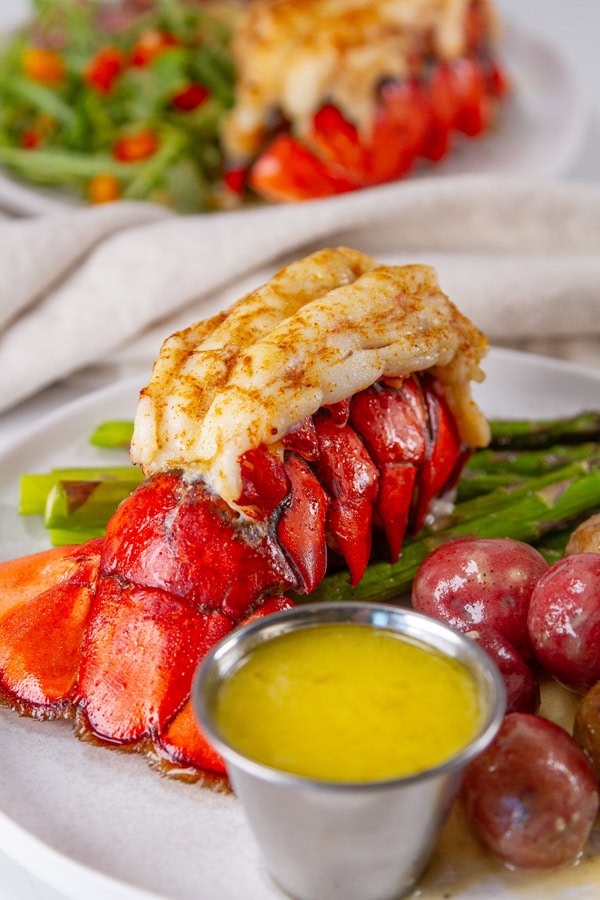 cooked lobster tail with Beurre Mont&eacute;, asparagus, and potatoes.