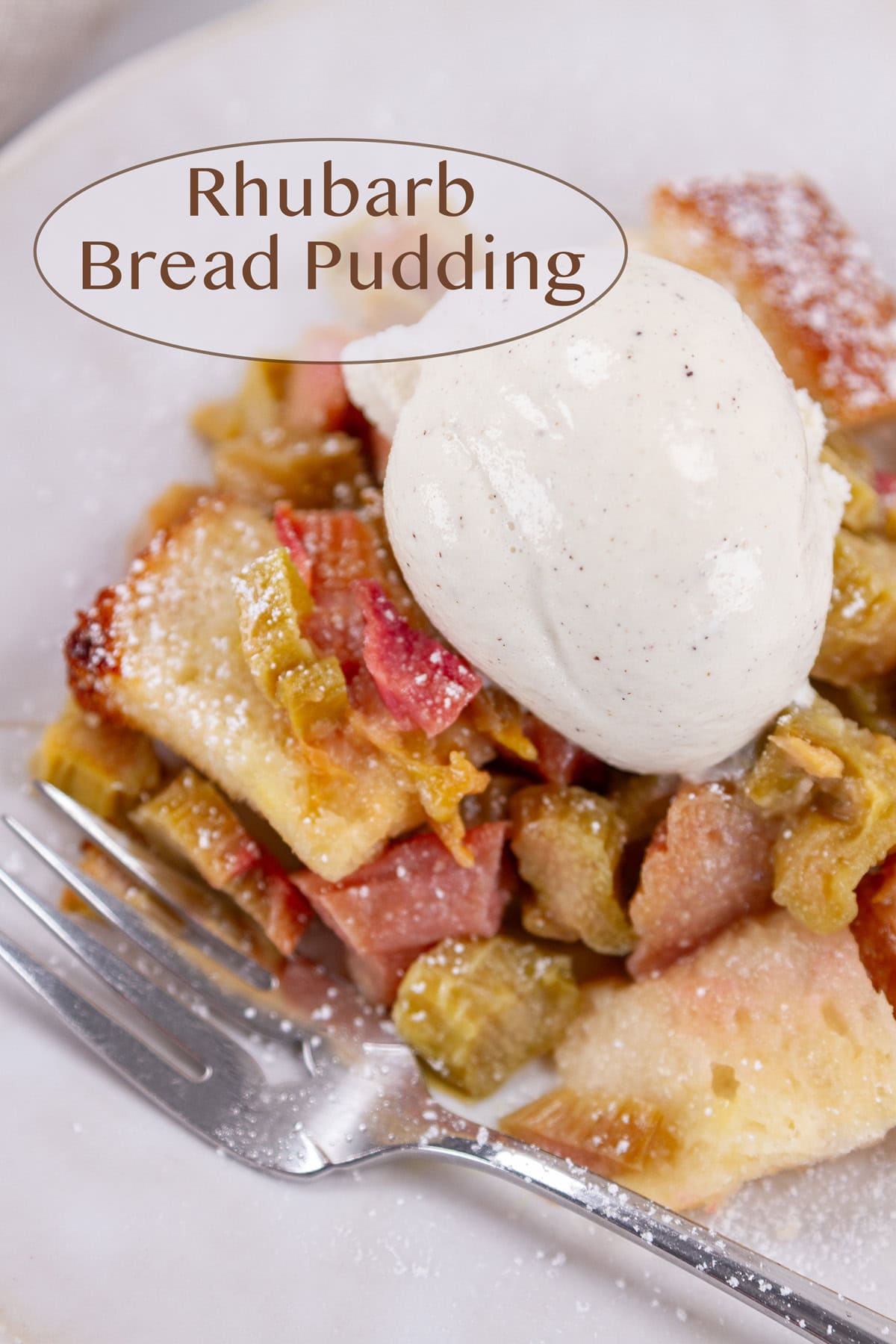 a serving of rhubarb bread pudding topped with vanilla bean ice cream.