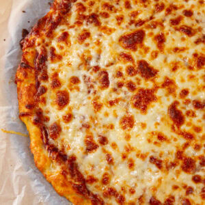 square crop looking down onto a cheese pizza.