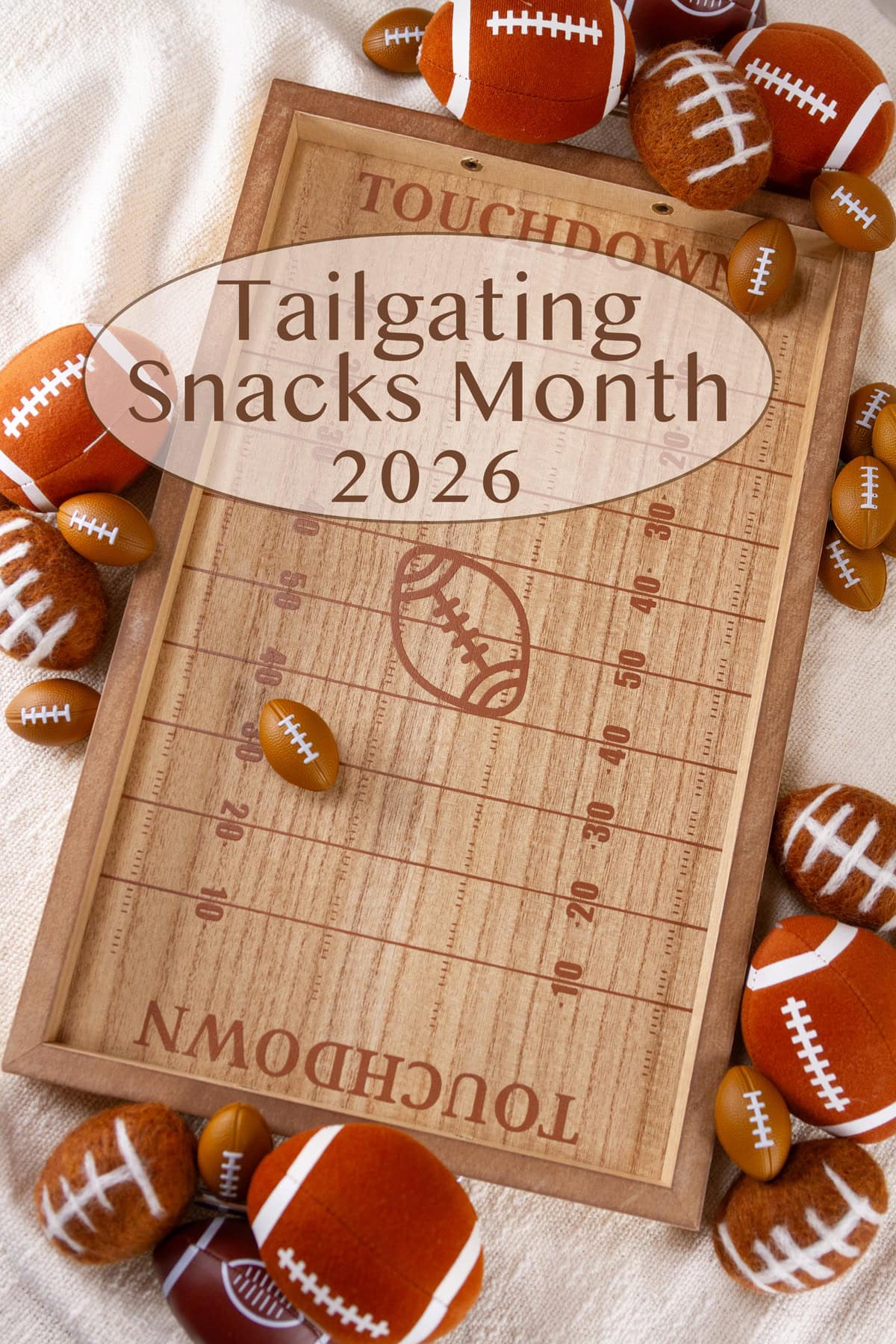 A wooden serving tray with football field markings on it and several small footballs around the tray.