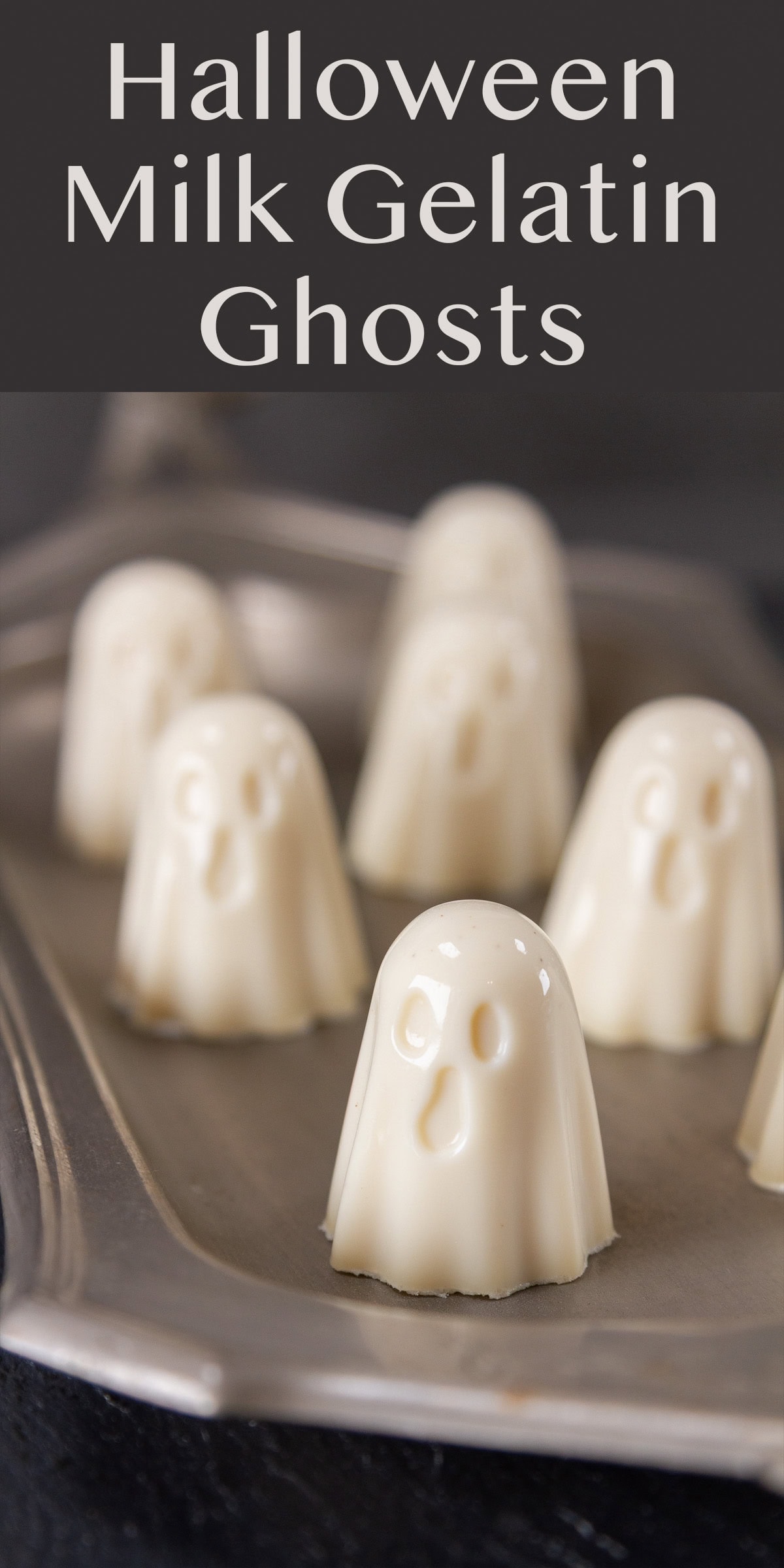 milk gelatin ghosts for Halloween on a pewter tray.