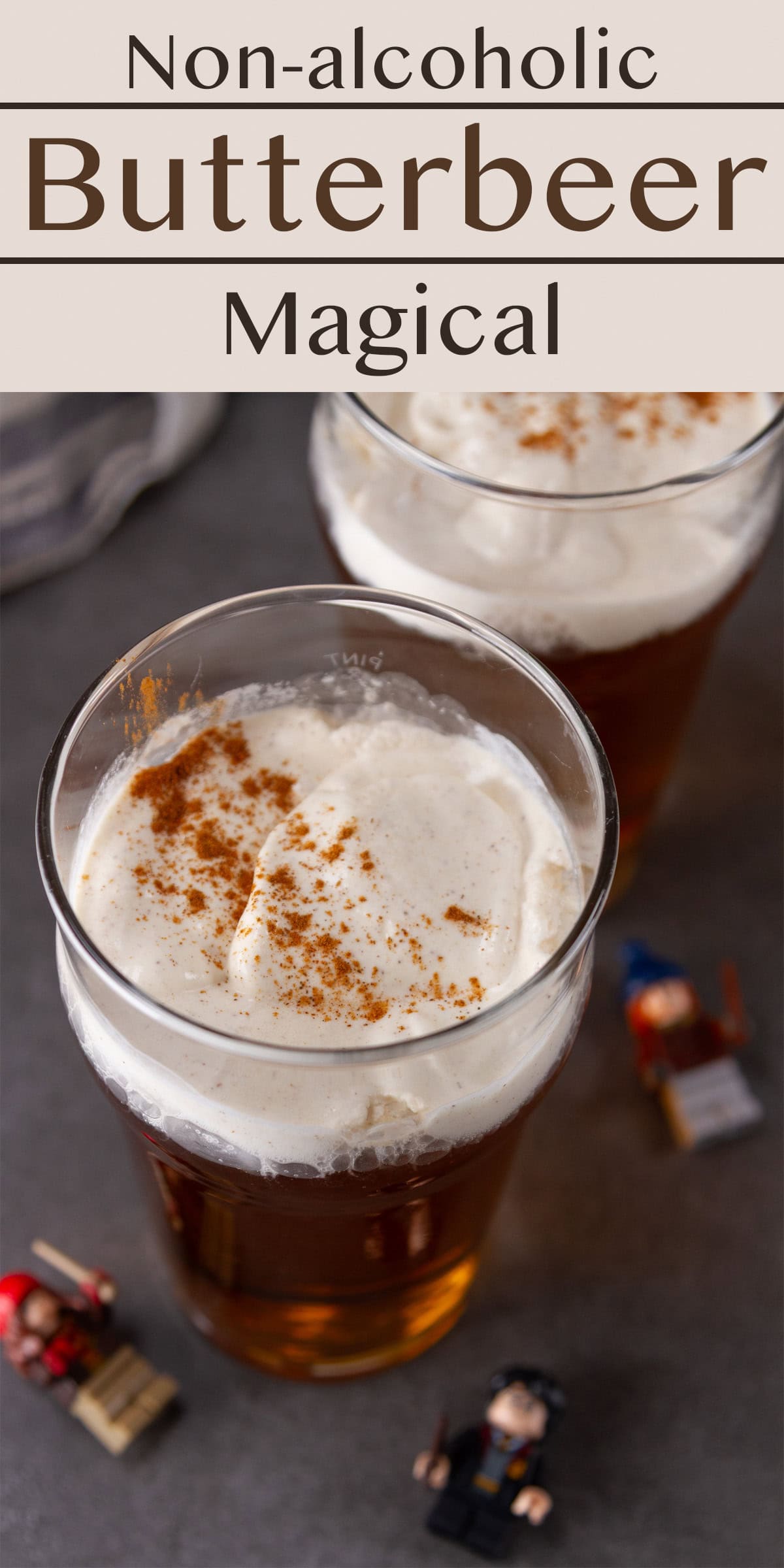Looking down on two glasses of butterbeer topped with butterscotch cold foam. 