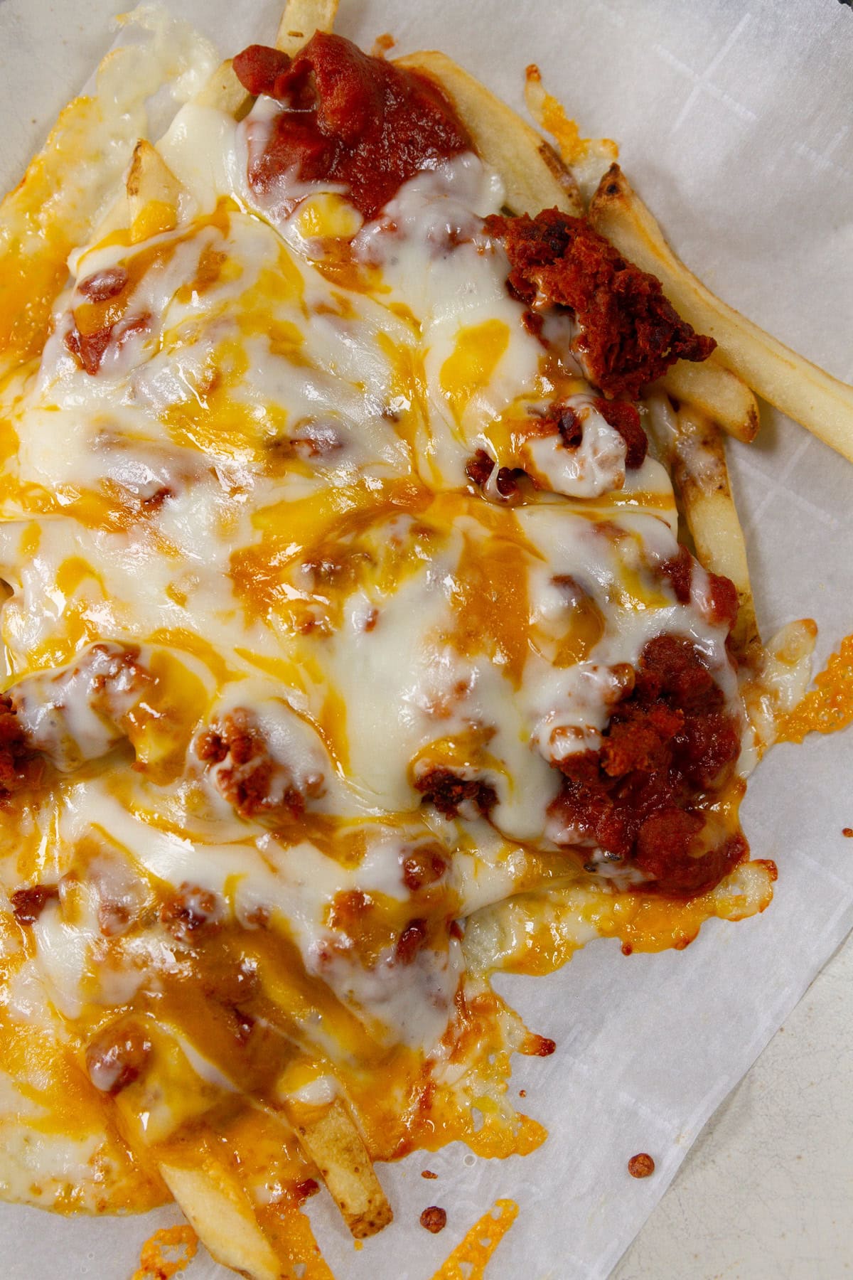 chili cheese fries on a white background.