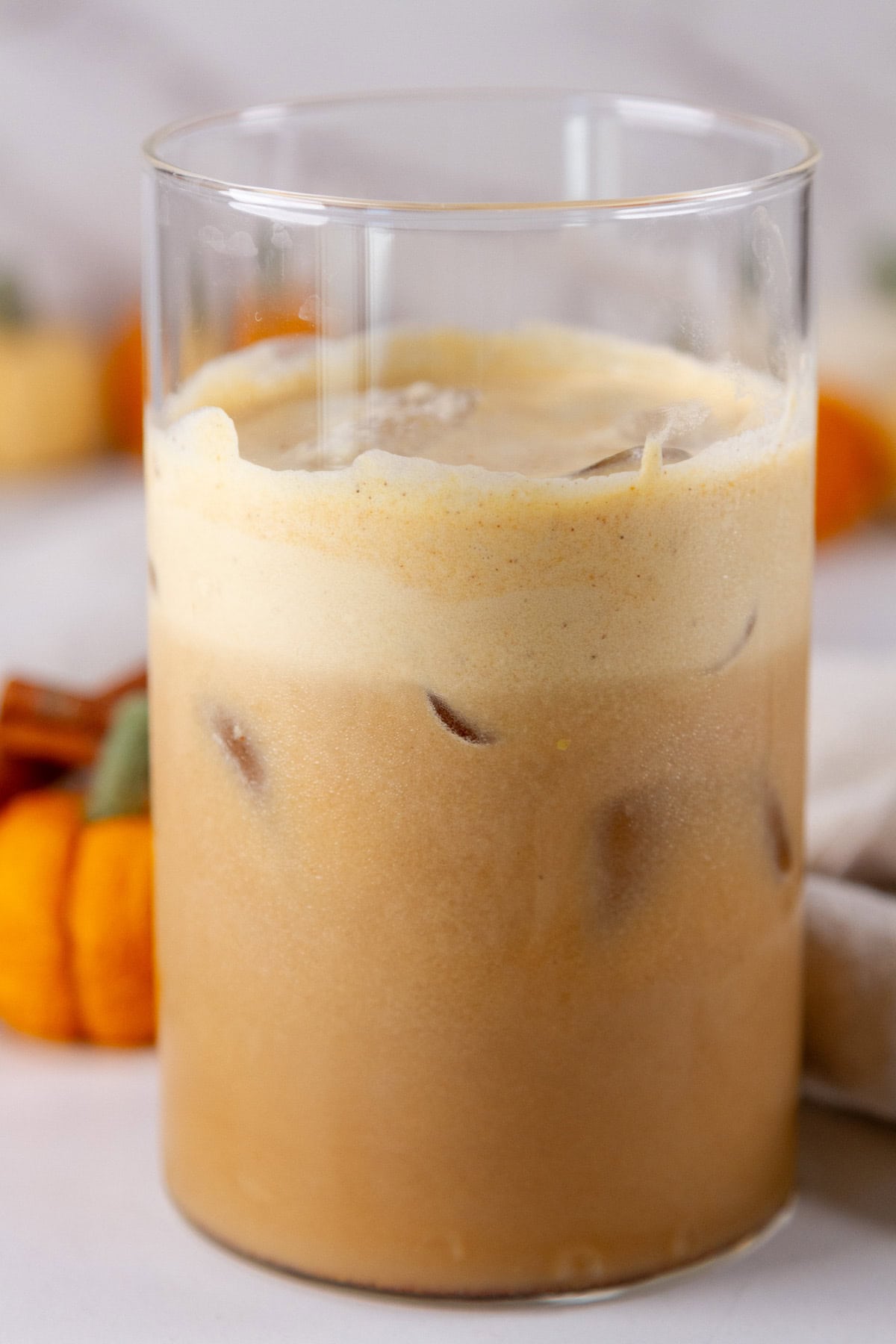 a glass of iced pumpkin cream cold brew latte.