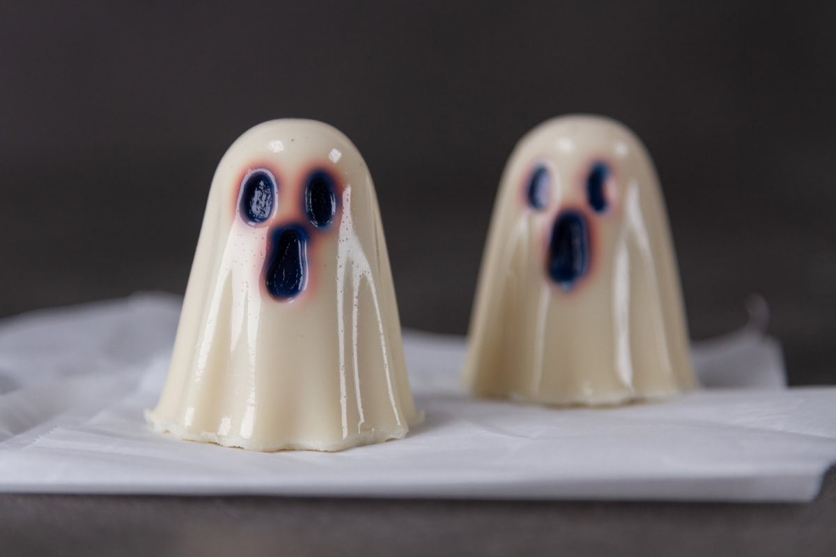 two gelatin ghosts with drawn on faces.