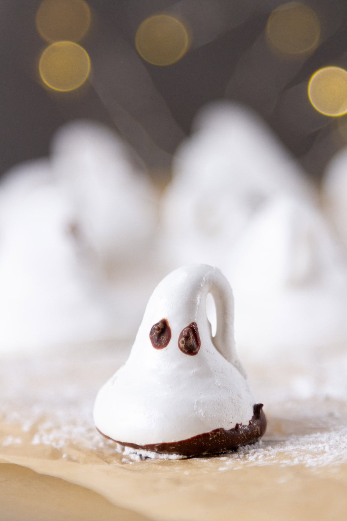 a marshmallow ghost with a chocolate dipped bottom.