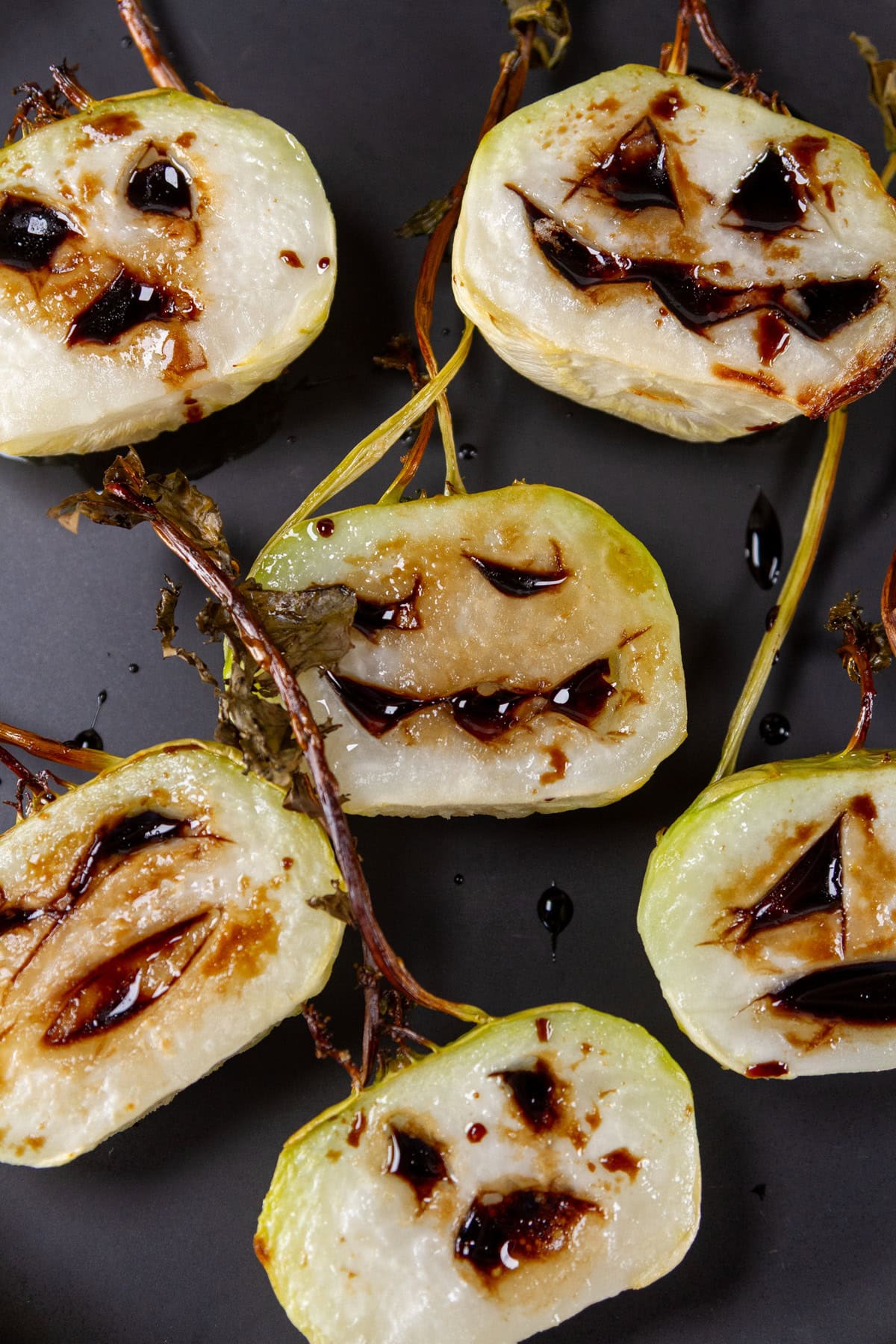 oven roasted kohlrabi with Halloween faces.