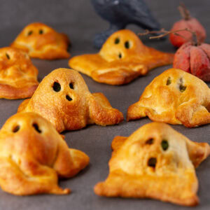 square crop of crescent ghosts on a black background.